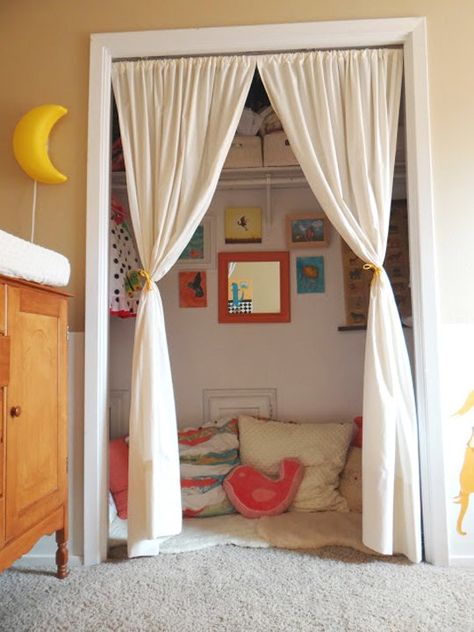 i love the curtains and the children's artwork on the wall :) Kids Closets Used as Reading Nooks Closet Nook, Reading Nook Closet, Zimmer Diy, Reading Nook Kids, Kids Closet, Shared Room, Kid Closet, Room Closet, Toy Rooms