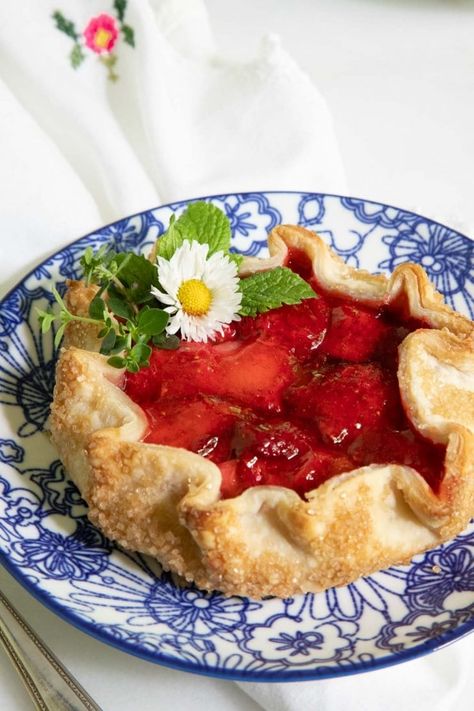 These fabulous fresh strawberry galettes are bursting with summery flavor. The super-easy recipe employs a 'cheat' ingredient - but no one will know (or care once they take the first delicious bite)! #strawberrygalette, #easystrawberrydessert, #strawberrytart, #strawberrypie Strawberry Galettes, Quick Sweets, Strawberry Galette, Easy Strawberry Desserts, Bakers Delight, Strawberry Festival, Homemade Cookbook, Strawberry Tart, Strawberry Season