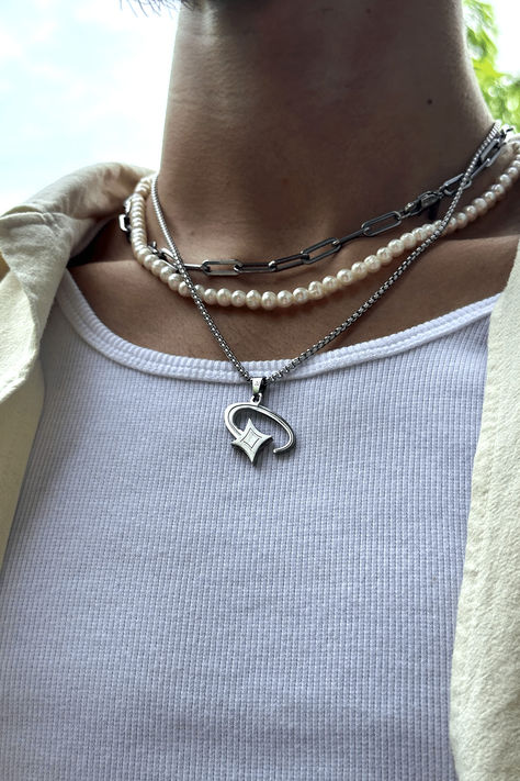 Picture of a silver shooting star pendant necklace for men. A unique cosmic jewelry piece made from stainless steel designed for streetwear fashion. It highlights a man's sense of style and individuality, perfect for a modern man who wants to stand out in urban fashion. #shootingstar #streetwear #stainlesssteeljewelry #menaccessory #modernjewelry Hamburger Press, Streetwear Jewelry, Burger Press, Mens Silver Jewelry, Star Box, Boys Jewelry, Hamburger Meat, Streetwear Accessories, Guys Clothing Styles