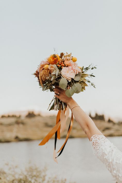 Golden Mustard Garden Roses are so dreamy for this bride's Rocky Mountain wedding. The grey green eucalyptus foliage and peach and orange ranunculus really bring it all together. We're in love! | Photo courtesy of Wild Jasmine Photography. Earth Tone Bridesmaid Bouquet, Golden Mustard Rose, Mustard Garden, Jasmine Photography, Orange Ranunculus, Wild Jasmine, Romantic Wedding Flowers, Rustic Orange, Rose Bridal Bouquet