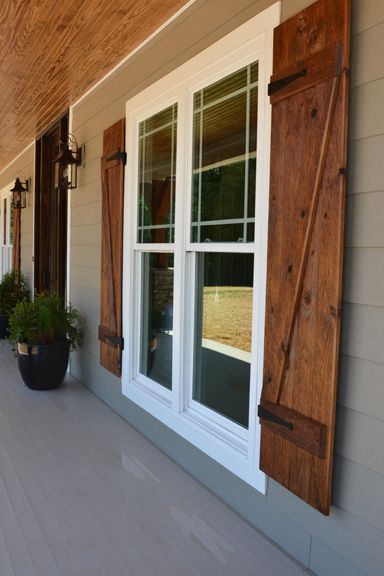 Front porch with custom ceiling, cedar posts, stone columns and wood shutters. Farmhouse Exterior Design, Shutters Exterior, Modern Farmhouse Exterior, Wood Shutters, Casa Exterior, Farmhouse Exterior, Style At Home, Exterior House Colors, Home Fashion