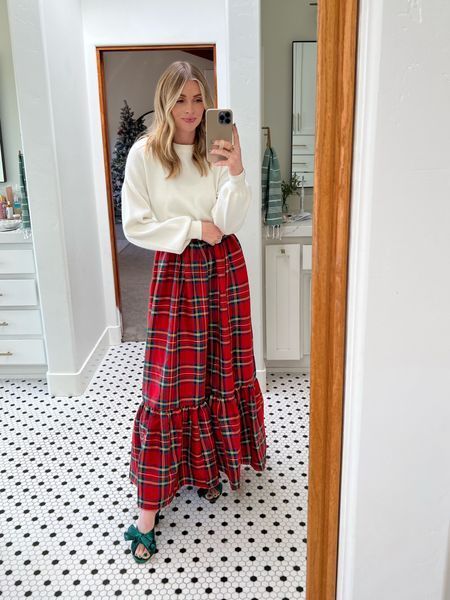 This red plaid maxi skirt from Red Dress is the perfect festive piece to add to your holiday looks. I paired it with these green heels from Amazon that I've posted a lot about and a basic white sweater. Let me know what you think! | festive, holidays, looks, party, outfits, style, sweater, maxi skirt, plaid, heels Red Plaid Dress Outfit Winter, Red White Christmas Outfit, Red Maxi Skirt Outfit Winter, Plaid Skirt Outfit Christmas, Long Red Plaid Skirt Outfit, Cold Weather Christmas Outfits, Holiday Church Outfit, Red Heel Outfits, Red Skirt Christmas Outfit