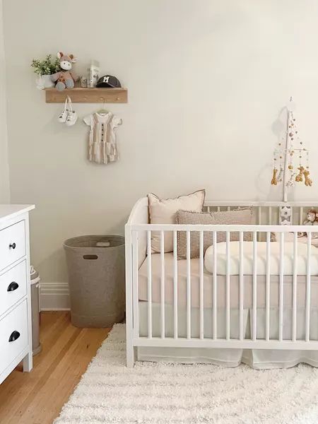 Modern neutral nursery Shop now: crib, mattress, crib sheets, rug, shelf decor, mobile setup, Home, cozy, gender neutral, minimal Modern Gender Neutral Nursery, Home Cozy, White Cot, Convertible Crib, Neutral Nursery, Gender Neutral Nursery, Crib Mattress, Nursery Neutral