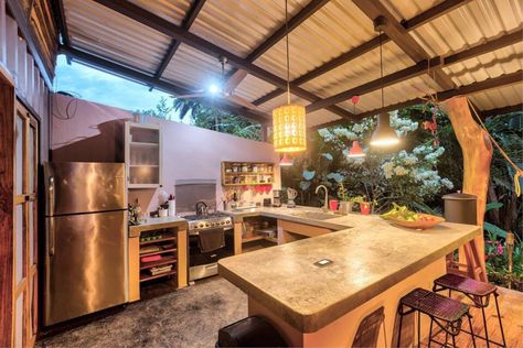 This eco-friendly jungle tiny house comes complete with an outdoor kitchen! A converted shipping container becomes the home of your dreams! Check out the way this shipping container adds life and beauty to the middle of the jungle! #tinyhouse #tinyhome #shippingcontainer #convertedshippingcontainer #convertedcontainer #tinyhouseliving Kitchen Ideas Philippines, Dirty Kitchen Design Philippines, Dirty Kitchen Design, Simple Outdoor Kitchen, Dirty Kitchen, Outdoor Kitchen Plans, Tiny House Community, Rustic Kitchen Design, Tropical House