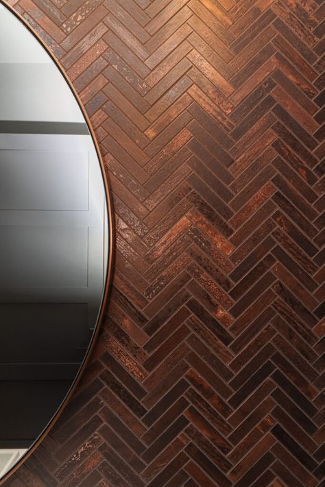 Chevron natural copper tile accent wall. Copper Accent Bathroom, Fireplace With Copper Tile, Copper Accent Wall Bathroom, Copper Tile Around Fireplace, Copper Shower Tile, Bathroom Copper Accents, Copper Tiles Bathroom, Accent Tile Bathroom, Copper Bedroom