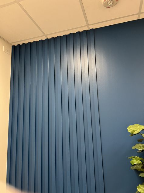 Blue Slat Wall, Navy Wall With Wood Slats, Dark Green Slat Wall, Navy Slat Wall, Blue Wood Panel Wall, Wood Slat Accent Wall Blue, Wood Slat Wall Commercial Design, Kitchen Island Plans, Stripped Wall