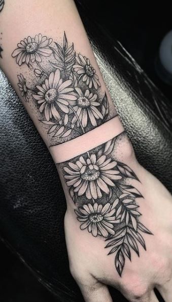 Daisy Cuff Tattoo, Womens Tattoo Drawings, Men Daisy Tattoo, Daisies Tattoo Sleeve, Daisy Tattoo Sleeve Forearm, Daisy Tattoo Black And Grey, Daisy Hand Tattoos For Women, Gerber Daisy Tattoo Sleeve, Black And Gray Daisy Tattoo