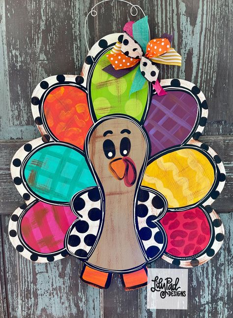 1/4" PRINTED wood door hanger. 26" Sealed and finished with a matching bow. Recommended for use on a covered porch. Thanksgiving Door Hangers, Door Hangers Halloween, Turkey Door Hanger, Fall Art Ideas, Thanksgiving Door Hanger, Turkey Door, Colorful Turkey, Home Decor Boutique, Christmas Door Decor