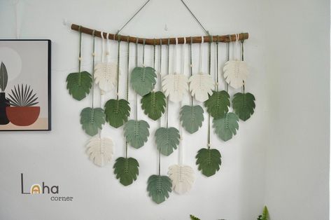 "\"Home isn't a place, It's a feeling\" ☘️Bring more nature, vintage and bohemian vibes to your space with our green macrame leaf wall hanging. ☘️ This can be a special, caring and decorative gift for birthdays, Mother's day or any anniversaries and gorgeously for your family living room, nursery or bedroom,... ☘️ Our Macrame Leaf Wall Hanging is handcrafted with natural friendly cotton cord, safe for you, your family and your children. The color in our feature picture are: Cream White, Olive Gr Hanging Monstera, Macrame Leaf Wall Hanging, Macrame Window Curtain, Leaf Wall Hanging, Boho Headboard, Macrame Feather Wall Hanging, Green Macrame, Macrame Leaf, Feather Wall Decor