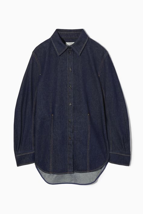 This utility-inspired piece is designed for an oversized cut and can be styled as a shirt or jacket. It's crafted from organic- and recycled cotton-blend denim and has a rounded shape that's enhanced by the dropped shoulders, slightly flared sleeves and stepped hem. The heavy topstitching and paneled construction define the silhouette. Oversized fit, pleated sleevesPointed collar, button closureOrganic cotton is grown from non-genetically modified seeds without chemical fertilizers or pesticides 80% Organic cotton, 20% Recycled cotton / Machine wash Back length of size 6 is 30.90" / Model wears a size 6 Oversized Button Up, Oversized Denim Shirt, Pleated Sleeves, Power Dressing, Genetically Modified, Silk Print Dress, Recycled Denim, Cardigan Top, Poplin Shirt