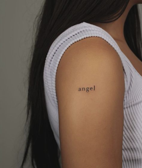 My Angel Tattoo Words, Angel Words Tattoo, Angle Word Tattoos, Angel Tattoo Letters, Simplistic Angel Tattoo, Angel Written Tattoo, Angel Tatoos Aesthetic, Minimalistic Angel Tattoo, Simple Tattoo Lettering