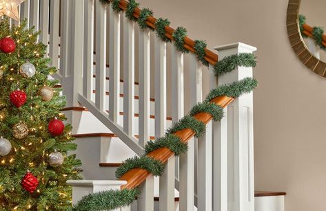 Christmas Greenery - The Home Depot Archway Christmas Decor, Christmas Staircase Decor Railings, Holiday Staircase, Staircase Garland, Green Holiday Decor, Foyer Stairs, Christmas Staircase Decor, House Lights, Christmas Staircase