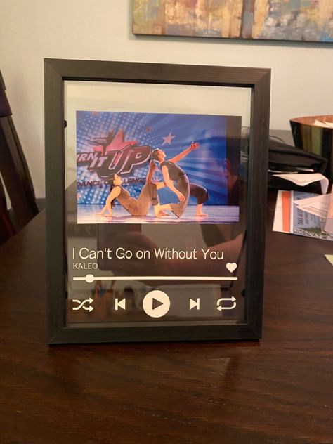 Added the vinyl to this float frame to mimic the Spotify play look. This gift was created for my daughter dance duet partner, featuring the name of the song they danced to. Senior Night Gifts Dance Team, Dance Pin Shadow Box Ideas, Dance Sister Gifts, Dance Sister Gift Ideas, Spotify Photo, Spotify Play, Dance Competition Gifts, Competition Gifts, Dance Duet