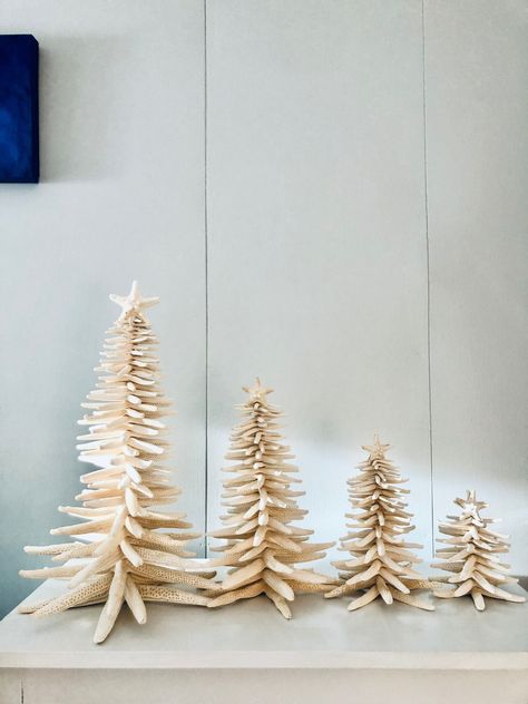 This Christmas tree is made of natural finger starfish.  It is a unique holiday decoration for the winter time. If you miss the beach in the winter this is something that will bring the beach to your home. Please select the tree size from the options added on the right of the picture.  Small - 5.5-6.5 inches tall Medium - 7.5 - 8.5 inches tall Large - 11.5 - 12.5 inches tall Extra Large 15.5 - 18 inches tall  All my trees are well packed for a safe transportation. Unfortunately I cannot accept returns on seasonal products. Seasonal products such as ornaments, wedding decor, Christmas trees and decors, Halloween and Thanksgiving decor. Coastal Xmas Tree, Beach Cottage Christmas Decor, Christmas Beach House, Coastal Winter Decor, Coastal Christmas Aesthetic, Coastal Holiday Decor, Beachy Fall Decor, Beach House Christmas Decor, Coastal Christmas Tree Ideas