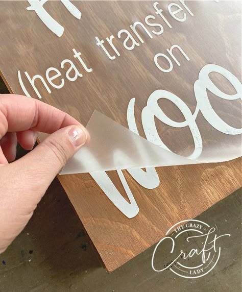 peeling away the HTV backing when using vinyl on wood Diy Sayings On Wood, Making Wood Signs With Cricut, Iron On Wood Cricut, How To Put Vinyl On Wood, Vinyl Lettering On Wood, Cricut Home Signs Diy, Words On Wood Signs Diy, Cricuit Ideas Diy Projects Wood, Heat Transfer Vinyl On Wood