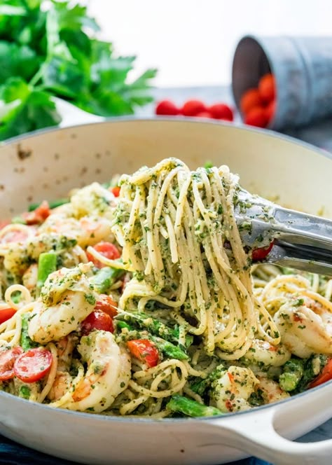 This Pesto Shrimp Asparagus Pasta can be on your dinner table in 30 minutes tops with your own fresh pesto made from scratch. Easy to make, delicious and packed with lots of flavor! www.jocooks.com #pesto Shrimp Pasta With Tomatoes, Saturday Recipes, Shrimp Asparagus Pasta, Asparagus Pasta Recipes, Shrimp Pesto Pasta, Shrimp Asparagus, Pasta With Tomatoes, Pasta With Shrimp, Pesto Shrimp