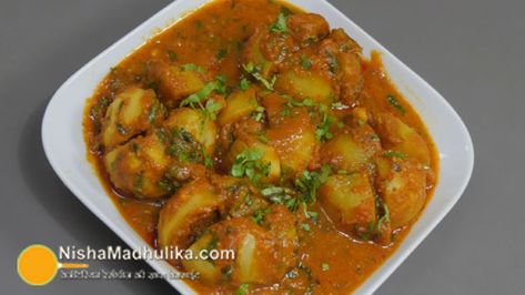 Bharwan tinda with gravy in Cooker | Stuffed Tinda Curry - Nishamadhulika.com Spicy Rice Recipe, Khandvi Recipe, Aloo Sabzi, Bharta Recipe, Aloo Curry, Potato Gravy, Veg Snacks, Savory Rice, Spicy Rice