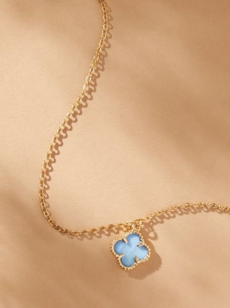 Simplicity in design but elegant in its statement, this 14K gold clover charm necklace is timeless in your jewelry box. Featuring a light blue clover charm outlined in gold and displayed on a dainty gold chain, this necklace creates an aura of beauty radiating from within and encapsulating its wearer. Altered State Jewelry, Light Blue And Gold Necklace, Gold And Blue Necklace, Cute Gold Necklaces, Gold Everyday Jewelry, Colorful Gold Jewelry, Blue Bead Necklace, Cute Blue Things, Blue Jewelry Aesthetic