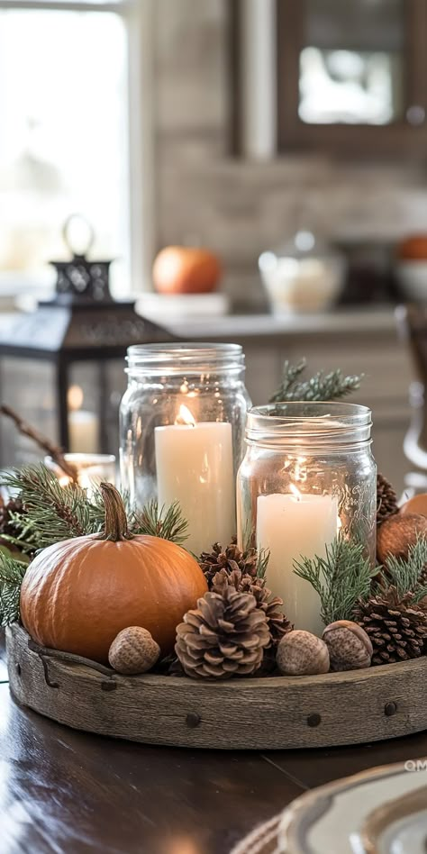 Cozy fall kitchen decor with a rustic tray featuring candles, pinecones, and a pumpkin, creating a warm and inviting autumn house decor atmosphere. Fall Decor With Mason Jars, Fall Kitchen Aesthetic, Fall Decor For Kitchen, Rustic Thanksgiving Decor, Fall Interior Decor, Fall Ambiance, Fall Table Decorations, Fall Table Centerpieces, Orange Home Decor