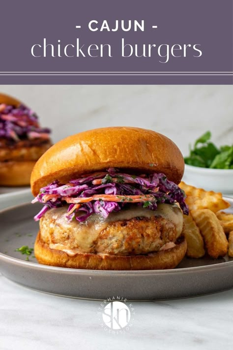 Filled with Cajun seasoning, these Cajun chicken burgers are easy to make, filled with flavor, and the perfect addition to the grill. Cajun Chicken Sandwich Recipes, Cajun Chicken Burger Recipe, Cajun Chicken Wrap, Cajun Chicken Caesar Salad, Cajun Grilled Chicken, Cajun Chicken Burger, Kay Nutrition, Nutritional Snacks, Chicken Burgers Recipe