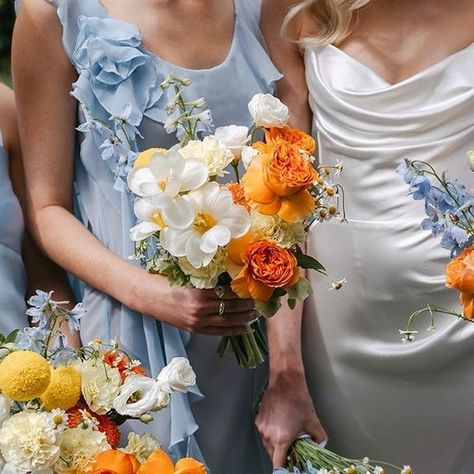 Mondo Floral Designs on Instagram: "Blooms for the B L U E S ⁠ ⁠ How stunning is this citrus inspired floral concept against the cool blue tones of the stunning bridesmaids dresses..... ⁠ ⁠ Image @beckrocchiphotography⁠ ⁠ ⁠ ⁠ ⁠ #coastal #style #sunshinecoast #noosaheads #design #wedding #weddinginspiration #bride #weddingday #weddingideas #weddingphotography #beach #ocean #flowers #love #photography #weddingflowers #floral #weddinginspo #botanical #beautiful #beauty #mondobride #mondofloraldesigns #noosaweddingflowers" Blue Green And Orange Wedding, Orange And Blue Bridesmaid Dresses, Yellow And Blue Bridesmaid Dresses, Citrus And Blue Wedding, Cyprus Aesthetic, Blue And Orange Wedding, Ocean Flowers, Light Blue Bridesmaid, Orange Bridesmaid