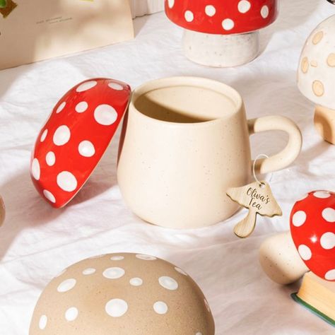 This Red Mushroom Mug with Lid will brighten up any kitchen. A fun addition to any Mushroom Mycologist out there. CAPACITY 320ml WEIGHT 440g W 9.50 x L 9.50 x H 10.20 cm you can also add a matching set of salt and pepper shakers for a sweet gift We can add a mushroom shaped wooden charm to your mug for a sweet surprise ! Made from Ceramic