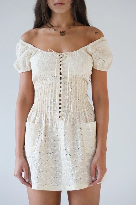 Pin Tuck Eyelet Dress is a mini length eyelet dress with a sweetheart neckline and pin tucked waist. 

Fit notes:

Runs true to size. If you are between sizes please size up.

 Mia is 5'8 and wears a size S 

(Bust: 32.5", Waist: 25", Hips: 35.5")

 *Vintage eyelets vary*

Dry Clean Only Beige Mirror, Mirror Palais, Cotton Mini Dress, Feminine Top, Grad Dresses, Dreamy Dress, Eyelet Dress, Embroidery Fashion, Pin Tucks