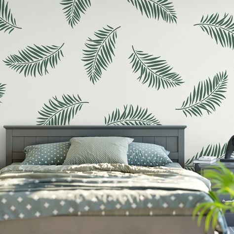 Minimalistic art, geometric patterns, and simple, functional accessories. Decorations Drawing, 2023 Home Interior, Leaf Wall Stencil, Modern Wall Stencil, Modern Living Room Design Ideas, Wall Stencil Designs, Room Makeover Ideas, Palm Leaf Pattern, Front Wall Design