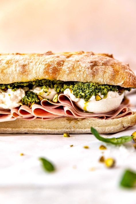 This Burrata Sandwich with fresh pistachio pesto and thinly sliced mortadella is the sandwich of my dreams! Not only is the taste amazing, but the texture too! A perfect make-ahead meal for lunches, picnics, and cookouts alike. One large sandwich will easily feed 6-8 hungry guests! #wellseasonedstudio #mortadella #burrata #sandwich Burrata Sandwich, Ciabatta Sandwich, Pistachio Pesto, Make Ahead Meals, Seasoning Recipes, Extra Virgin, The Taste, Butternut Squash, Pistachio