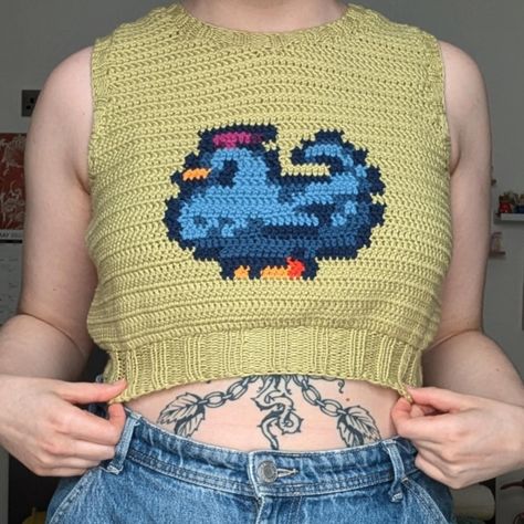 I never posted pics of me as actually wearing my stardew blue chicken top and I got a new phone so my pics are actually half decent now so taking it as an opportunity to repost it hehe #stardewvalley #stardewvalleycrochet #chrochet #stardewvalleyfanart Blue Chicken Stardew Valley, Stardew Valley Crochet Pattern, Stardew Valley Farm Layout Beginner, Crochet Stardew Valley, Stardew Chicken, Stardew Valley Crochet, Crochet Sweater Vest, Blue Chicken, Easy Crochet Projects