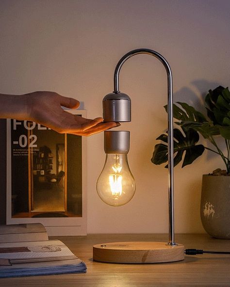 This remarkable lamp not only illuminates your space with a gentle, warm glow but also astonishes with its unique levitating light bulb, held aloft by the power of magnets. The levitating light bulb is no mere illusion – it emits a soft, diffused light that bathes your surroundings in a soothing ambiance. 🔍 Product: Levitating Lamp 👆 Tap the link in bio for more unique lamps! . . . . . . . . . . . . . . . . . . #decorcrushing #interior4u #interior4inspo #sassyhomestyle #inspireushomedecor #... Bed Lamp, Magnetic Levitation, Floating Desk, Light Bulb Lamp, Lamp Cord, Luminaire Design, Desk Light, Lamp Bulb, Desk Lamps