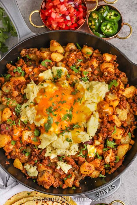 Start the day off right with this chorizo hash recipe. Spicy or sweet chorizo sausage is fried with bacon and then cooked with smooth and silky Yukon Gold Potatoes. Topped with eggs and cheese and then baked in the oven, this chorizo hash is so cheesy and filling. Make it a complete breakfast with a cup of coffee or tea!  #chorizohash #chorizobreakfast #beakfastchorizohash #spendwithpennies Best Mexican Breakfast Recipes, Papas And Chorizo, Mexican Breakfast For A Crowd, Chorizo And Beans, Chirozo Breakfast Recipes, Recipes With Chorizo Sausage Dinners, Chorizo Dinner Ideas, Mexican Breakfast Bowl, Beef Chorizo Recipes Dinners