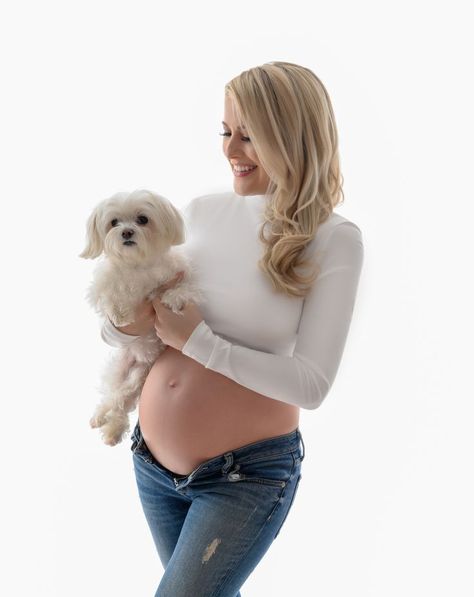 Mama to be photographed in white crop top and blue jeans, family dog joins in photo. Maternity portrait by Glow Portraits NYC  in studio located in Midtown Manhattan. Maternity Dog Photoshoot, Maternity Photoshoot With Dog, Pregnancy Photoshoot With Dog, Pregnancy Photos With Dog, Maternity With Dog, Photography Poses With Dogs, Maternity Shoot With Dog, Maternity Photography With Dog, Maternity Photos With Dog