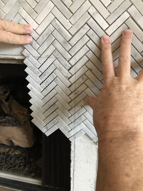 How to Add Herringbone Marble Tile to a Fireplace - Southern Hospitality Tile Around Fireplace, Herringbone Fireplace, Hearth Tiles, Fireplace Feature Wall, Fireplace Redo, Fireplace Update, Fireplace Tile Surround, Brick Fireplace Makeover, Fireplace Built Ins