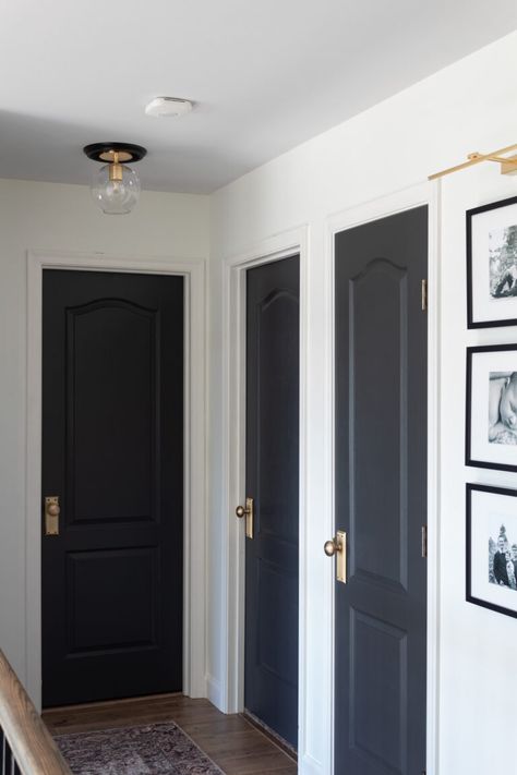 Black Door Hallway Decor, Blue Interior Doors Hallways, Dark Door Hallway, Make Doors Look Expensive, Black Hallway Doors White Trim, Black Interior Doors Small House, Hall With Black Doors, Black Interior Doors Dark Floors, Hallway All One Color