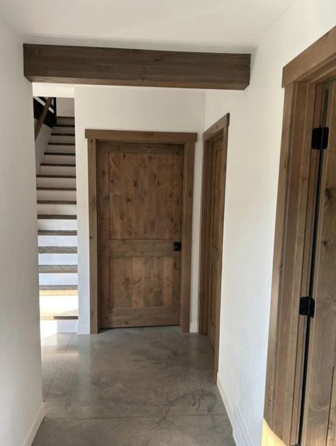 Building My Own House, Wood Doors With Wood Trim, Dark Wood Doors, Rustic Wood Interior Doors, Wood Doors Wood Trim, Cabin Interior Doors And Trim, Wood Doors White Baseboards, Wood Stain Trim Interior, Stained Trim With Painted Doors