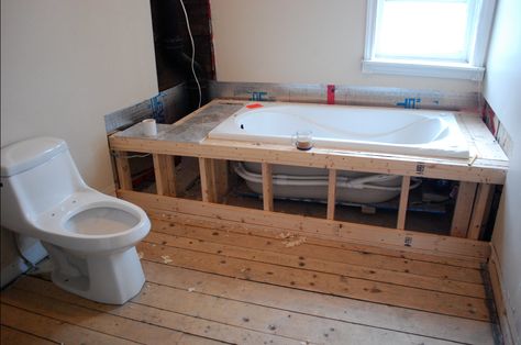 Build a frame around a bathtub, and install tiling for a built-in bathtub.  If you can, try to make a door or some way for easy access if you have to mess with the pipes or drain in the future. Drop In Tub Surround, Drop In Tub Ideas, Tub Surround Ideas, Sunken Bath, Concrete Bathtub, Bathtub Surround, Built In Bathtub, Diy Bathtub, Drop In Tub