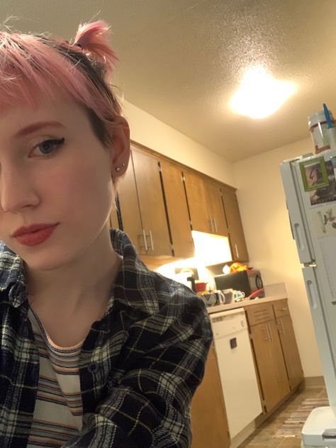 Femme person with short pink hair in a grown out pixie cut. Their hair is pulled into two tiny ponytails on top of their head. They are half out of frame and are not smiling. Their eyebrows are pink too. Pink Eyebrows, Pixie Cut, Color Me, Eyebrows, Style Me, Hair Styles, Hair, Pink, Color