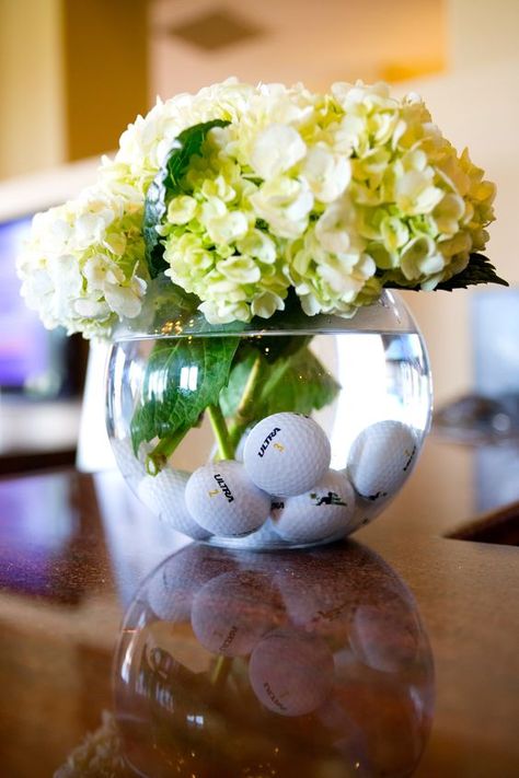 Golf birthday party centerpiece made with a glass vase, green hydrangea, and golf balls. Golf Centerpieces, Golf Theme Party, Golf Party Decorations, Golf Ball Crafts, Golf Events, Golf Wedding, Golf Birthday Party, Golf Decor, Golf Event