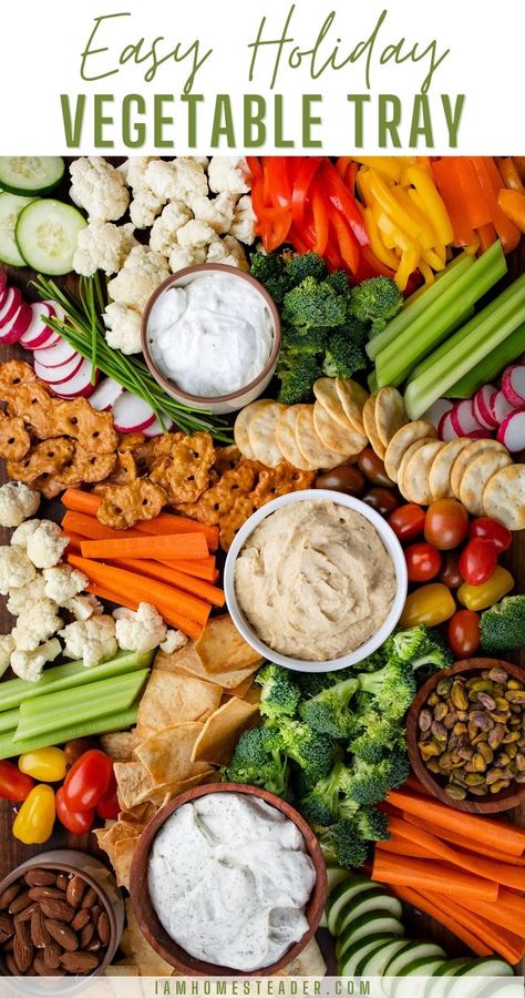 An overhead view of a vegetable tray with a variety of vegetables, crackers, nuts, and dips. Vegetable Trays Ideas Parties, Veggie Crackers, Christmas Vegetables, Budget Clean Eating, Crudite Platter, Vegetable Tray, Vegetable Platter, Appetizer Platters, Charcuterie Inspiration