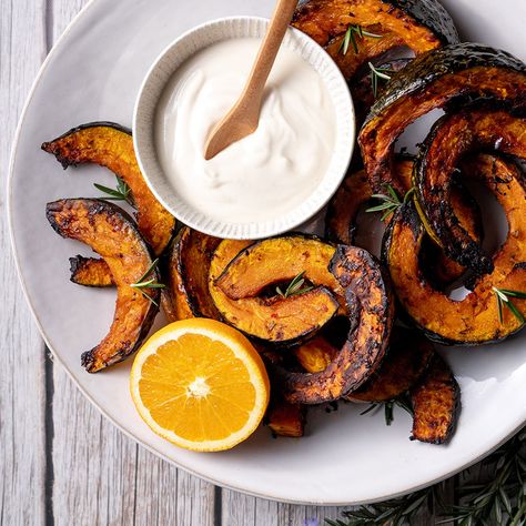 Soul warming roast buttercup pumpkin flavoured with rosemary, orange and chilli, served with a creamy orange infused coconut yoghurt and tahini sauce. Pumpkin Chilli, Pumpkin Healthy, Food Sides, Coconut Yoghurt, Kabocha Squash, Creamy Spinach, Roast Pumpkin, Tahini Sauce, Pumpkin Flavor