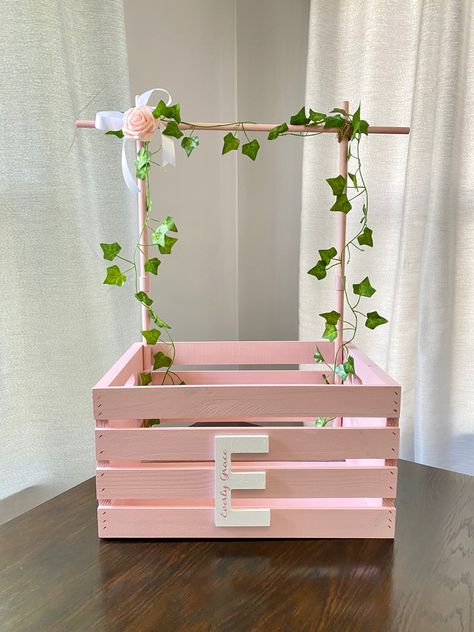 Diy Wooden Basket Ideas, How To Make Hamper Box At Home, Baby Shower Gifts Clothes Rack, Crate Closet, Baby Shower Clothing Rack, Diy Baby Closet Crate, Birthday Crate Gift Ideas, Baby Crate Closet, Welcome Home Baby Girl