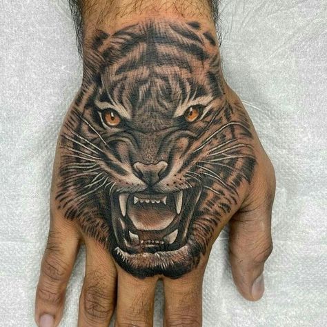 Tiger Tattoo On Hand For Men, Loin Hand Tattoo, Tiger Hand Tattoo Men, Panther Hand Tattoo, Tiger Tattoo Hand, Hand Lion Tattoo, Avicii Tattoo, Shoulder Cover Up Tattoos, Tiger Hand Tattoo