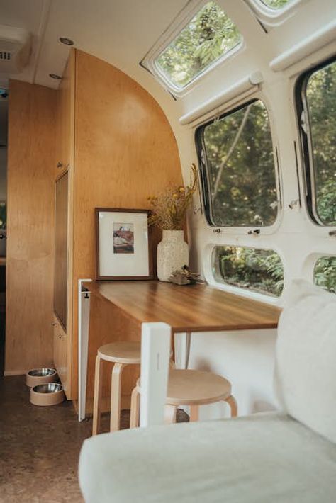 A 1973 Airstream Gets an Organic Remodel Inspired by Frank Lloyd Wright - Dwell Ikea Stool, Airstream Living, Airstream Campers, Corian Countertops, Airstream Remodel, Airstream Trailers For Sale, Airstream Interior, Airstream Renovation, Vintage Airstream