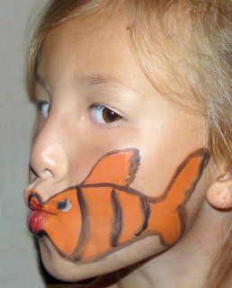 fish face painting@Kimmey Battles. we should do this one at the starlight festival!!:) Fish Face Painting, Face Painting Unicorn, Fish Makeup, Homemade Face Paints, Fish Face, Face Painting Easy, Kids Face Paint, Unicorn Halloween, Dining Room Ideas