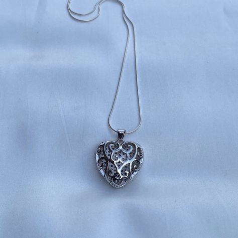 Both sides of this heart pendant are beautiful and will add versatility to your accessories. It comes on a sterling silver snake chain with a delightful silky feel. Wear it by itself or stack it with other necklaces. Necklace- Length: 16 or 20 inches- Width: 0.7mm- Clasp: spring clasp- Metal: 925 sterling silver- Finish: high polishPendant- Size: 23x22x9mm, Hole: 3mm- Material: Brass and Cubic Zirconia- Metal Color: Platinum Orders ship within two days Monday to Saturday Sterling Silver Heart Necklace, Silver Snake Chain, Silver Heart Necklace, Dream Jewelry, Sterling Silver Heart, Pretty Jewellery, Sterling Silver Necklace, Metal Color, Necklace Length