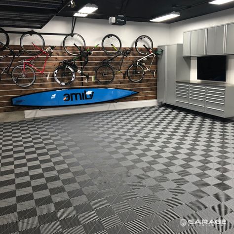 Laying down garage flooring doesn’t have to be intimidating! Read our guide for everything you need to know on installation! Featured: Swisstrax Ribtrax Tiles in Slate and Pearl Gray. #garageflooringinc #floor #flooringinspiration #flooringtrends #flooringcompany #flooringideas #flooringdesign #garage #garagemakeover #garagegoals #garagefloor #garageflooring Diy Garage Floor, Garage Flooring Options, Modular Garage, Organized Garage, Garage Storage Inspiration, Garage Tile, Modular Tile, Garage Floors, Garage Floor Tiles