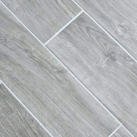 Tier03 - 12" x 24" Italian Tile, 8" x 36" Tile Planks - 13 available colors Pictures may show choices not included with base price, or are no longer available from supplier. The builder reserves the right to improve choices by revising the specifications without notice. Please see selection team for current availability. Gray Wood Look Tile Floor, Bathroom Remodel Wood Tile, Condo Flooring, Tile Looks Like Wood, Gray Wood Tile Flooring, Wood Tile Floor, Tile Grout Color, Grey Wood Tile, Wood Grain Tile