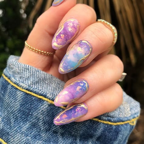 Universe Nails Design, Purple Opal Nails, Pokemon Inspired Nails, Pokemon Nails Designs, Purple Galaxy Nails, Acrylic Nails Galaxy, Pastel Galaxy Nails, Pokemon Nail Art, Almond Nails Designs Galaxy