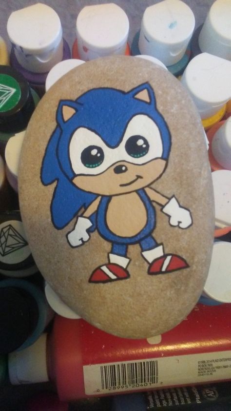 Chibi sonic the hedgehog painted rock. 801 rocks Sonic Painted Rock, Sonic Rock Painting, Sonic The Hedgehog Craft, Sonic The Hedgehog Painting, Painted Rocks Characters, Rock Painting Characters, Cartoon Painted Rocks, Character Rock Painting, Cartoon Rock Painting